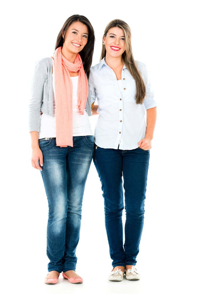 Happy casual girls smiling - isolated over a white background