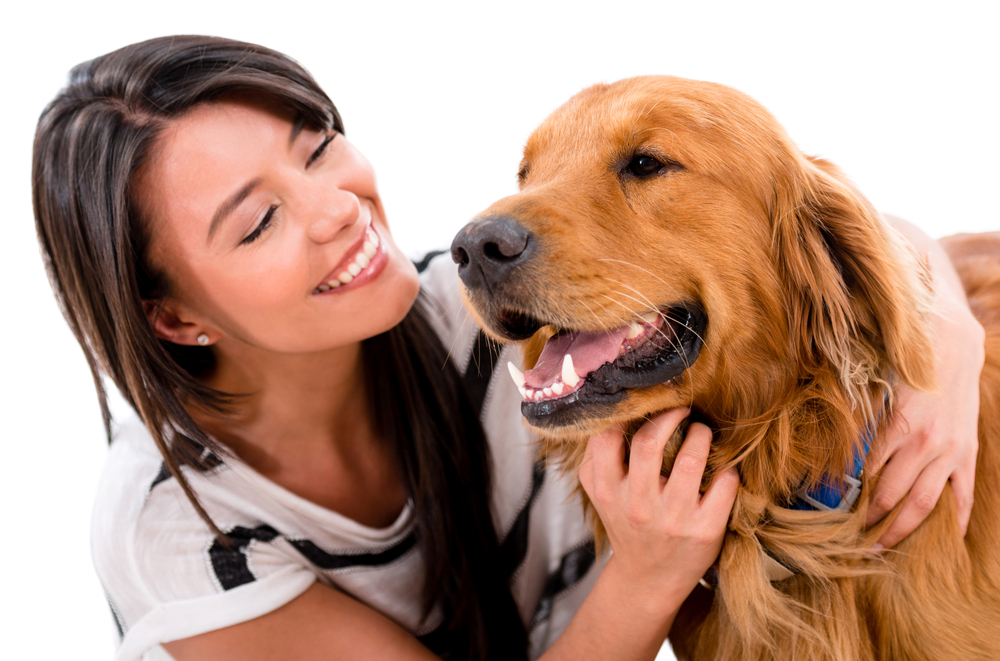 Happy woman with a cute dog - isolated over white background Happy woman with a cute dog - isolated over white background